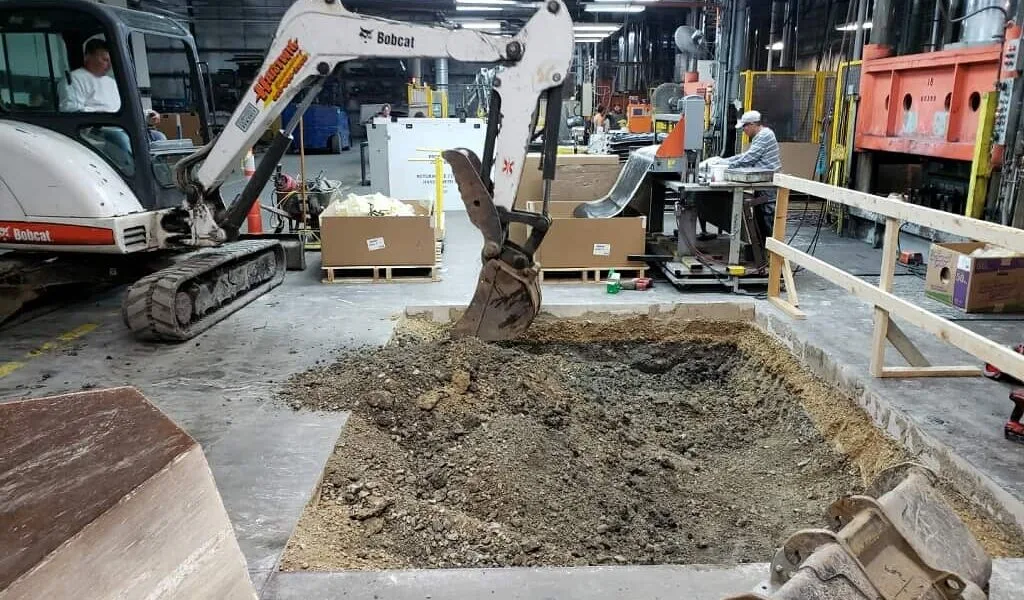 Concrete work underway inside a commercial facility